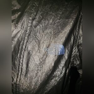 The North Face silver metallic multi zipper pockets weather proof hoodie